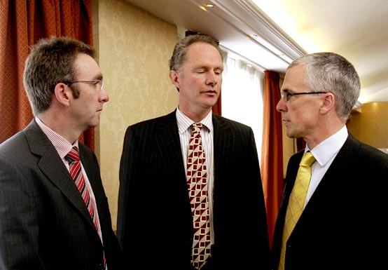 Garth Boyd, left, president NI Grain Trade Association and Owen Brennan, past President, debate the future of the agri food industry with John Henning, Head of Agriculture, Northern Bank
