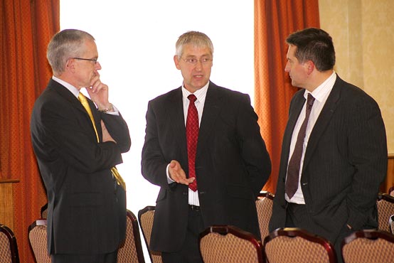 Declan Billington and Willis Mackey emphasise a point to John Henning, Head of Agriculture, Northern Bank at the NIGTA lunch
