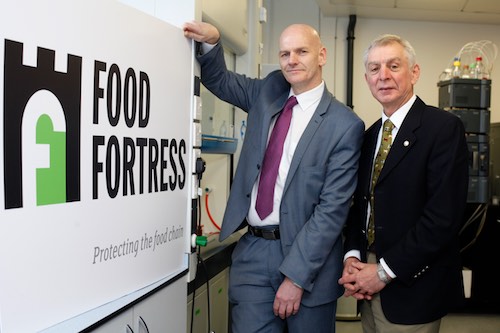 Professor Chris Elliott, left, from Queens University is delighted to launch the new branding for Food Fortress as 47 companies representing 99.9% of the animal feed trade in Northern Ireland are now participating in the scheme. Also included is Robin Irvine,  who is managing the scheme on behalf of the trade. Photograph: Columba O'Hare 