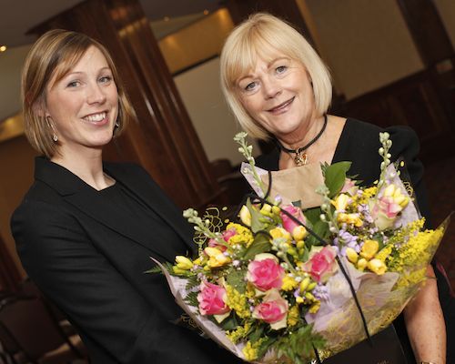Outgoing NIGTA President Claudine Heron presents a bouquet to NIGTA Secretary Doris Leeman at the Association's AGM in appreciation of her work through the year. Picture: Columba O'Hare